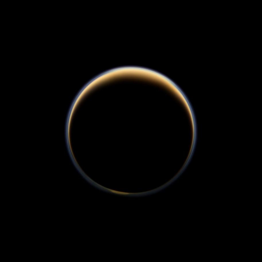 This night-side photo of Titan taken by the Cassini spacecraft shows a buildup of haze over the Saturn moon&#039;s south pole. 