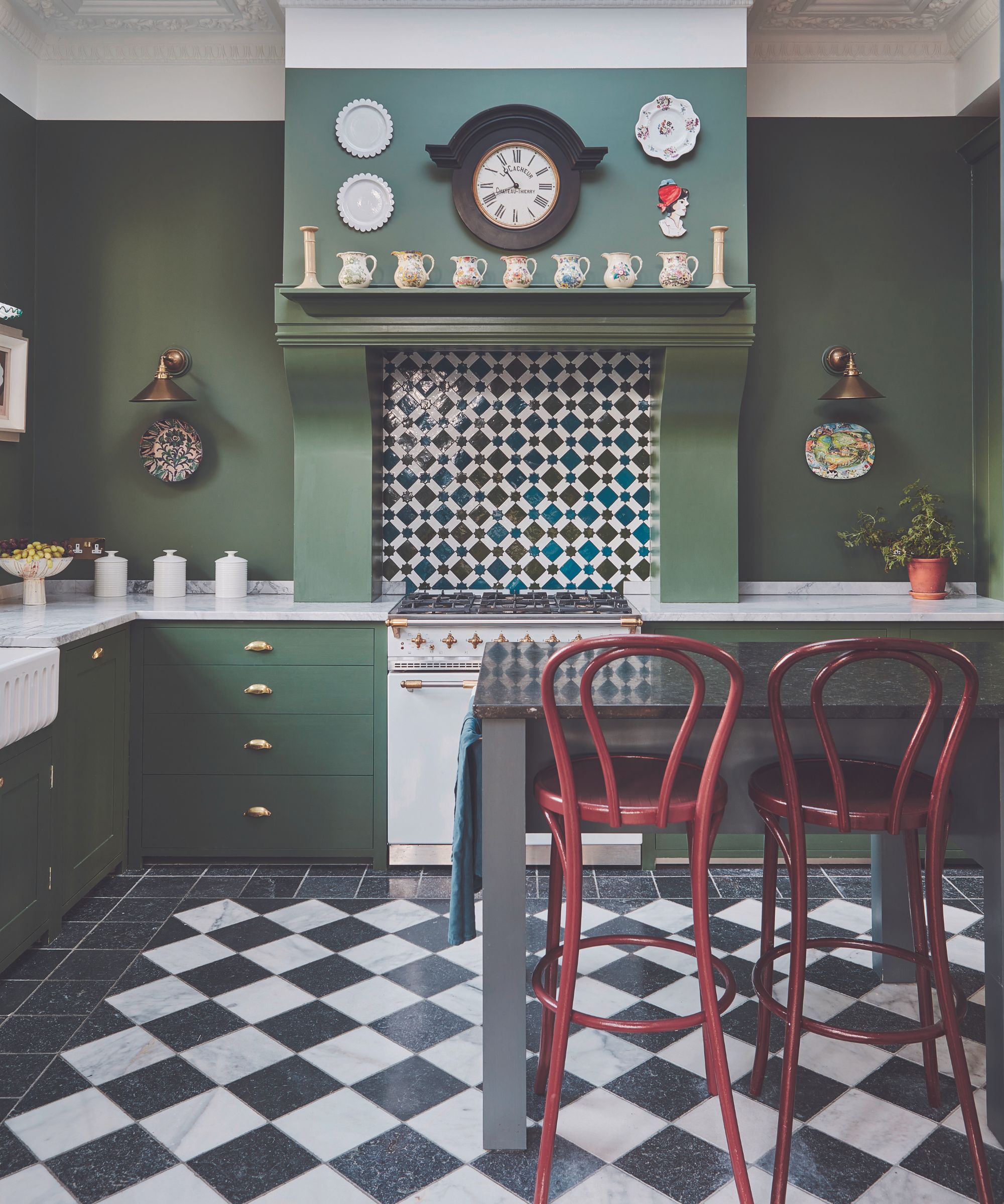Green kitchen with checkerboard flooring