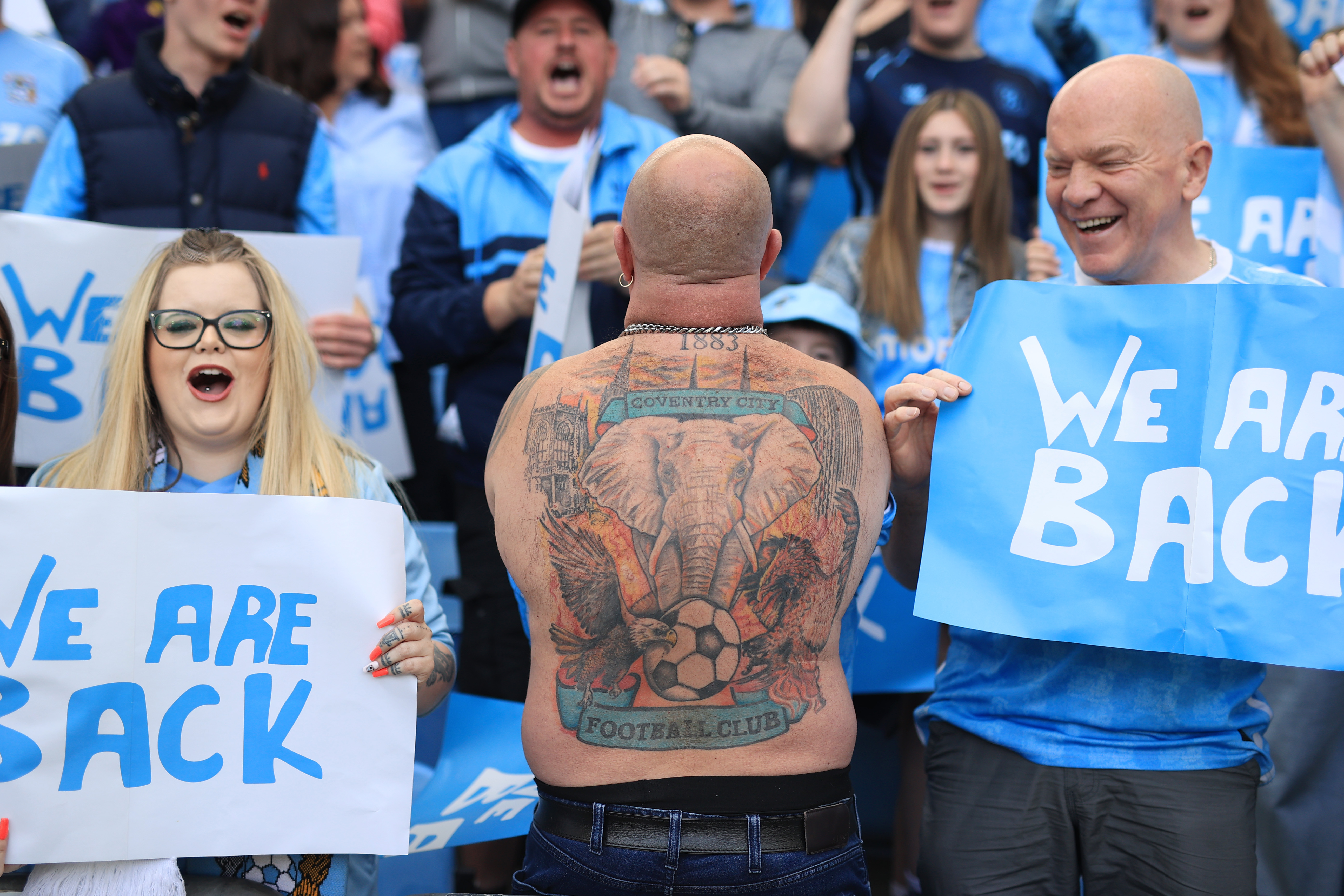 COVENTRY, ENGLAND - APRIL 26: A Coventry City fan reveals a tattoo of the club crest on his back during the Sky Bet Championship match between Coventry City and Wrexham AFC at The Coventry Building Society Arena on April 26, 2026 in Coventry, England. (Photo by Simon Stacpoole/Offside/Offside via Getty Images)