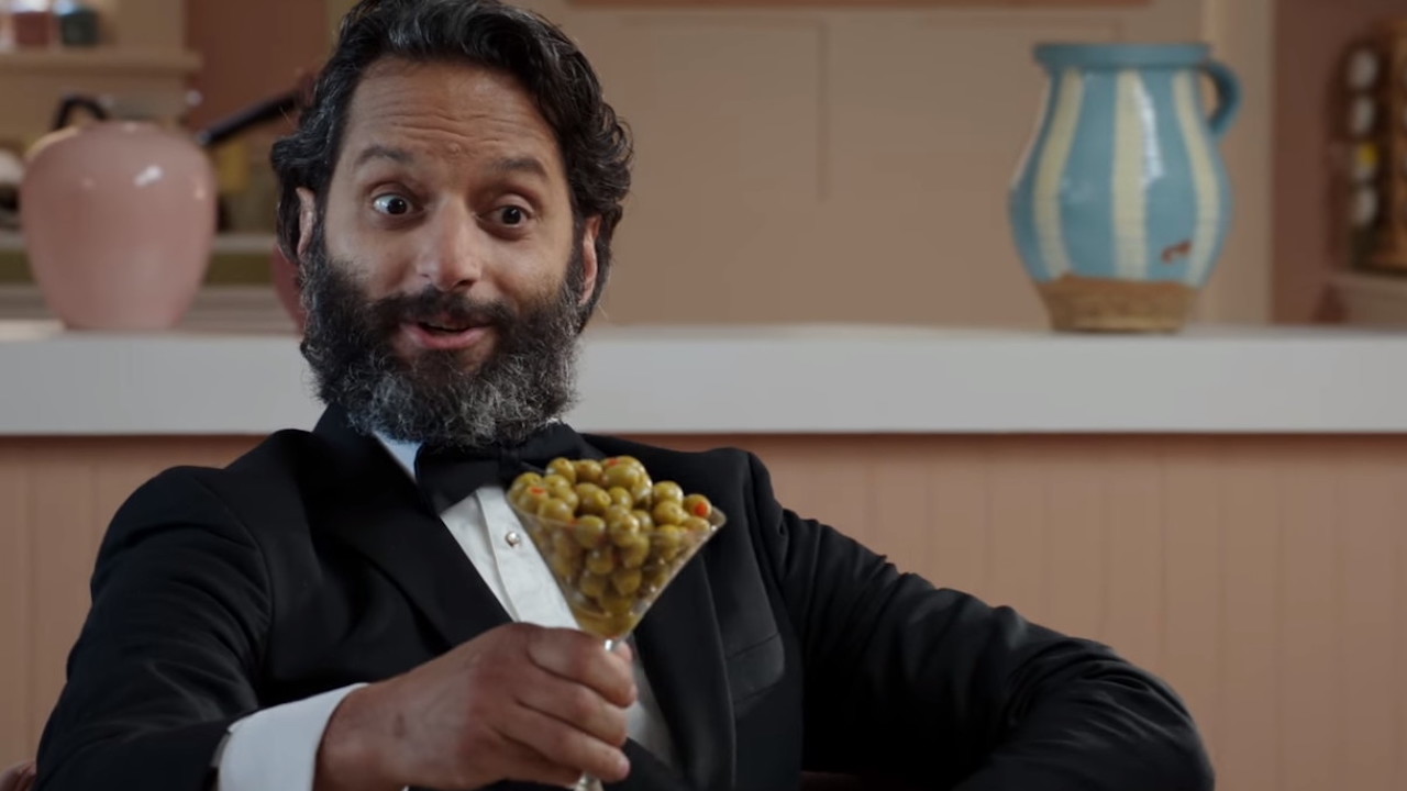 Jason Mantzoukas with a glass of olives at The Good place