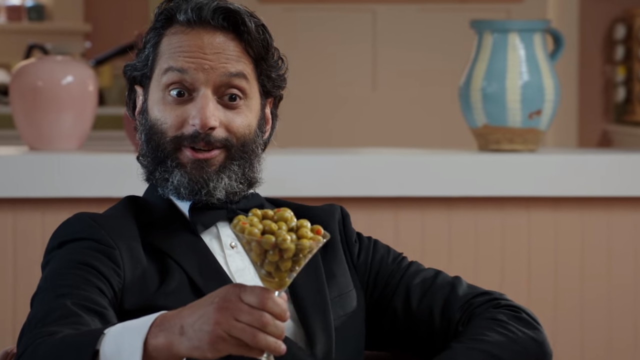 Jason Mantzoukas with a glass of olives in The Good place