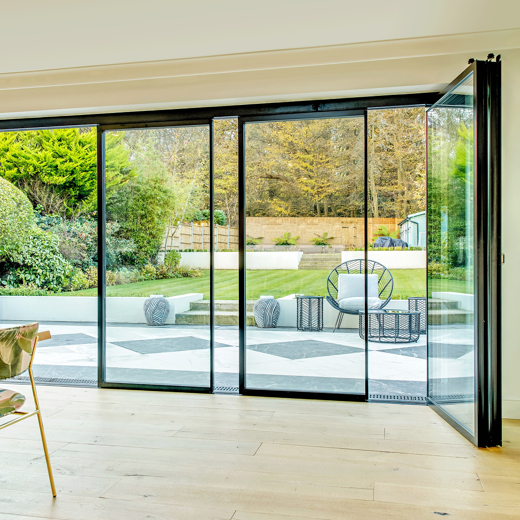 Slide and turn doors overlook a garden