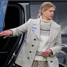 Lady Louise wearing a fairisle sweater and blazer walking out of a car