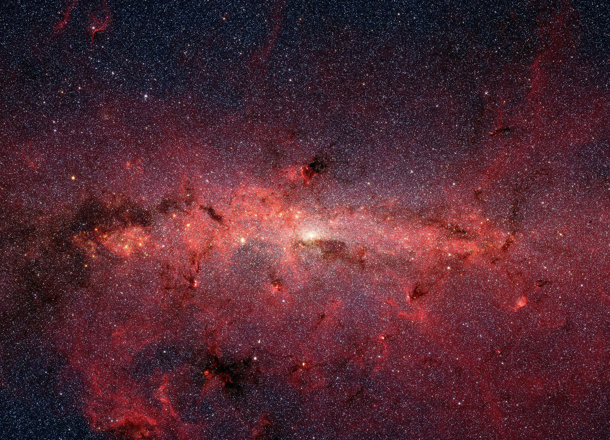 Clouds of red and purple sit on a dark background