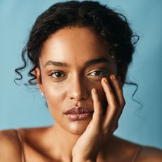 model wearing moisturizer on her face
