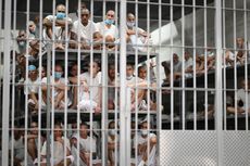 Inmates look on as they remain in a cell at the Counter-Terrorism Confinement Centre (CECOT) mega-prison, where hundreds of members of the MS-13 and 18 Street gangs are being held, in Tecoluca, El Salvador on January 27, 2025. The CECOT, the largest prison in Latin America and emblem of the war against gangs of the government of President Nayib Bukele, celebrates two years since it was inaugurated on February 1.