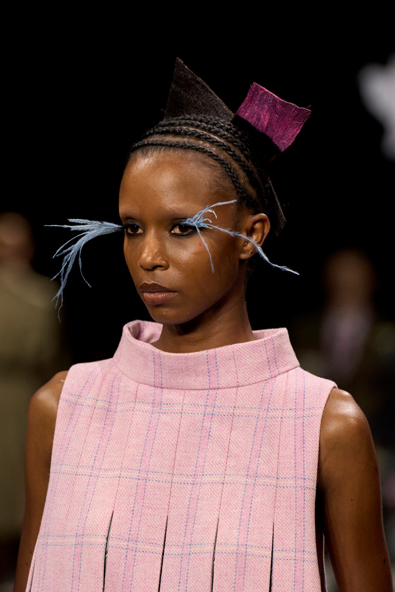 A model at Thom browne wearing statement lashes, a key Fashion Week Autumn/Winter 25 beauty look