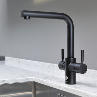 kitchen sink with black tap