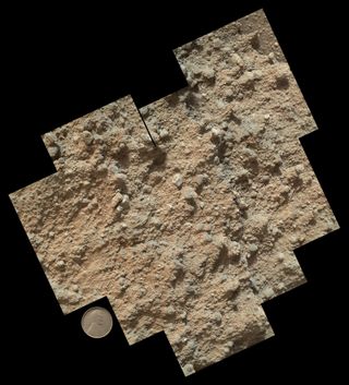This mosaic of nine images, taken by the Mars Hand Lens Imager camera on NASA's Mars rover Curiosity, shows detailed texture in a conglomerate rock bearing small pebbles and sand-size particles. The rock is at a location called "Darwin," inside Gale Crater. Image taken Sept. 21, 2013.