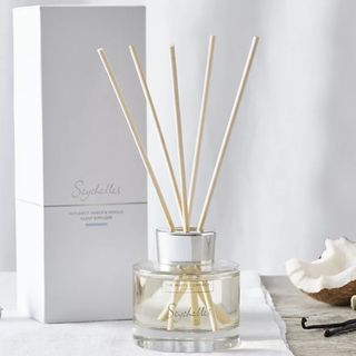 Seychelles diffuser with coconut and vanilla in the background