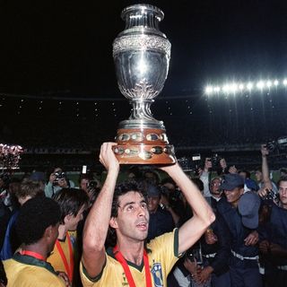 Mauro Galvao holds aloft the Copa America trophy after Brazil's win over Uruguay in July 1989.