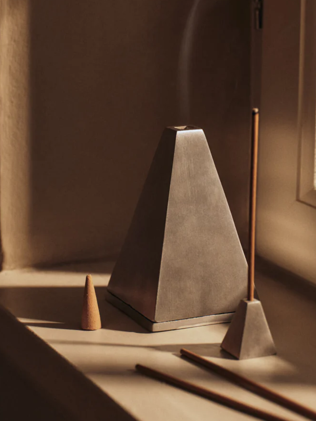 A pyramidical silver incense burner from Ferm Living