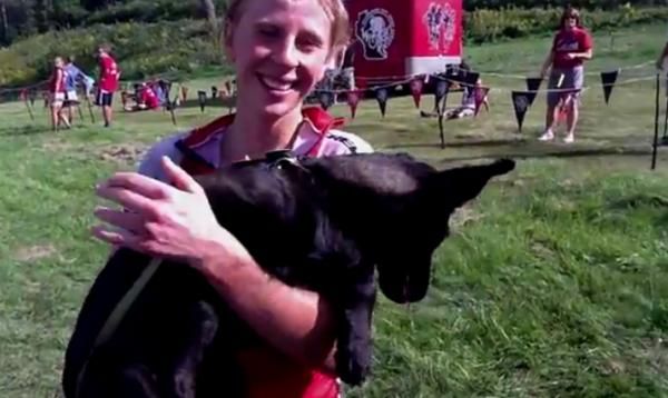Abby Strigel (Trek Stores of Madison) poses at the finish line with her new puppy.