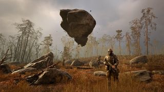 Stalkers encounter a floating rock in a russet grassy area of the Zone