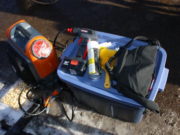 Some of the handiest gadgets in the pit area are the Craftsman handheld compressor gun and the Nomad portable washer.