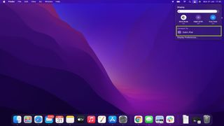 macOS home screen with iPad highlighted in display settings