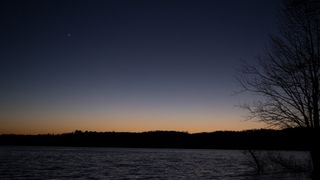Conjunctions are happily, common in the night sky. Here is a past one: Jupiter (left) and Saturn (right) are seen after sunset above Jordan Lake during the "great conjunction" on Dec. 21, 2020, near Chapel Hill, North Carolina.