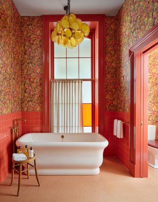 a bathroom in oranges, pinks and yellows