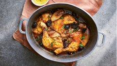 A pot of chicken with beaukolais, prunes, shallots and thyme
