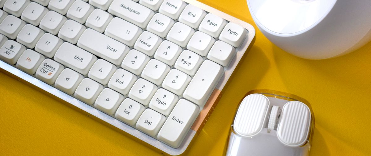 Lofree Flow mechanical wireless keyboard photograph showing number pad with similarly colored desk accessories.