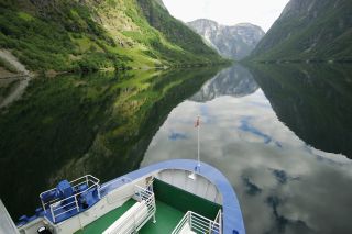 A ferry going through the water in Naeroyfjord
