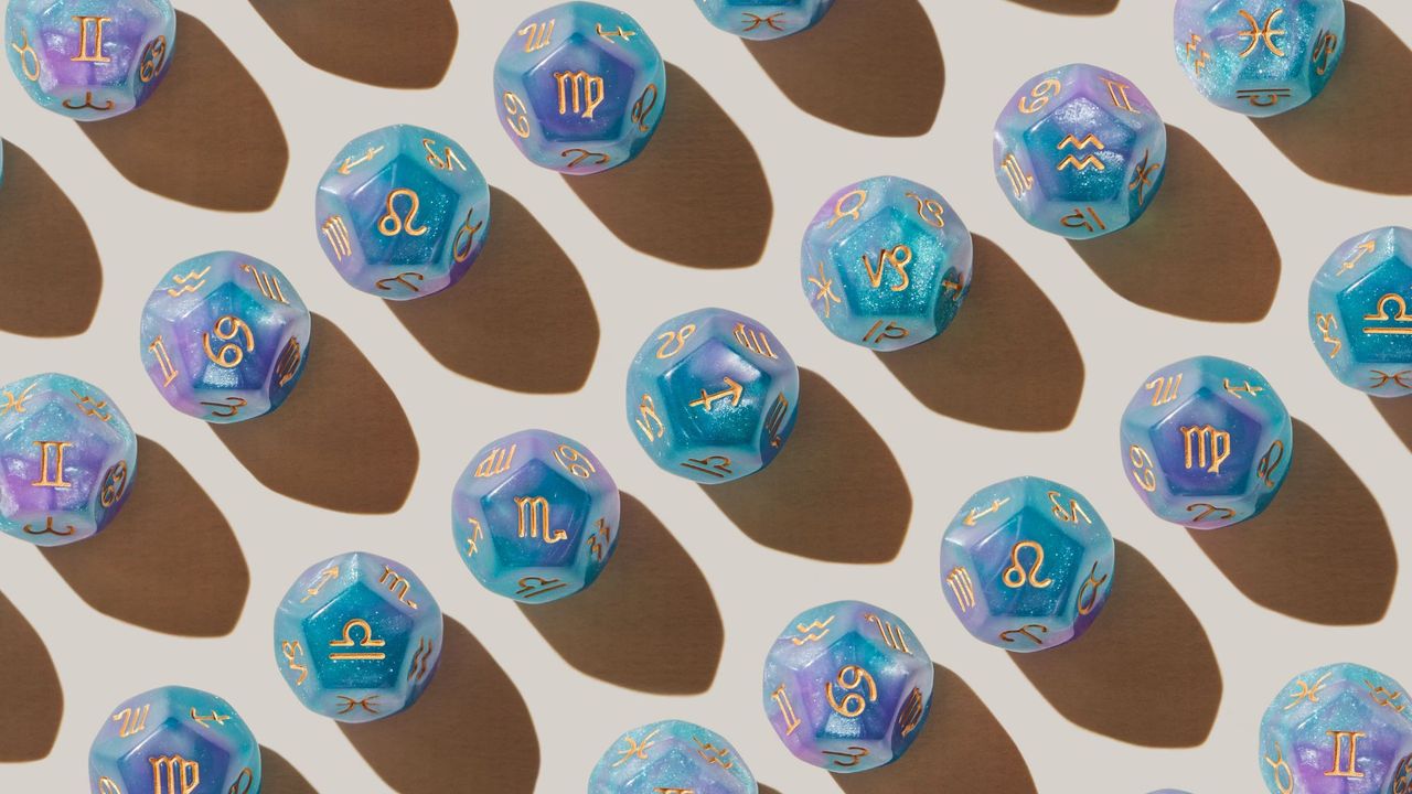 Zodiac dice laid out for an article on Lucky Girl trend