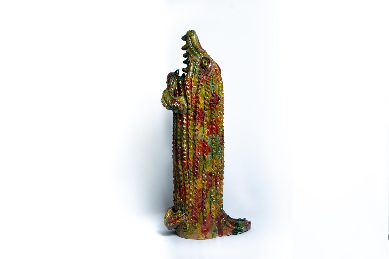 Colourful animal head ceramic vessels