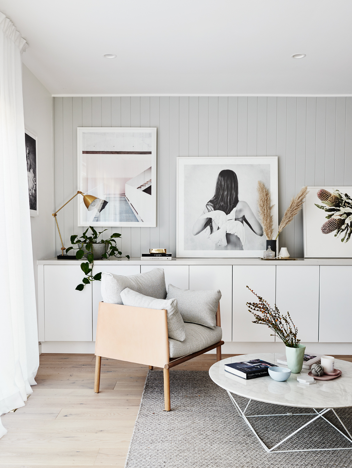 living room with shiplap wall