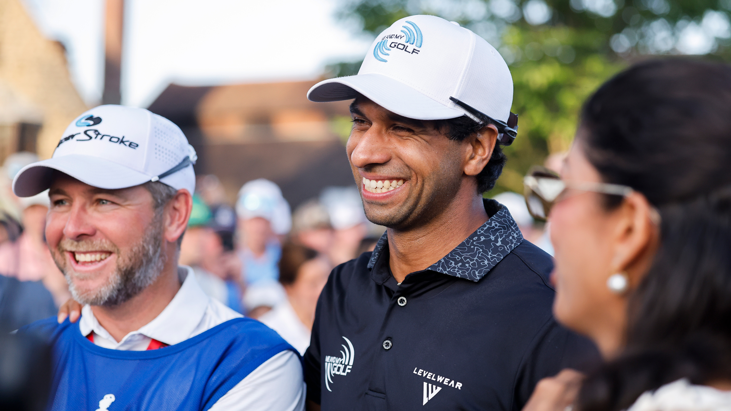 Aaron Rai smiles with his caddie after winning the 2026 PGA Championship