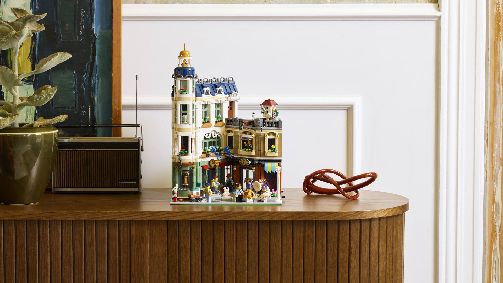 A Lego building laid out on a side board