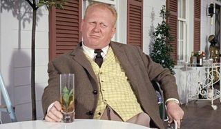 Goldfinger Auric Goldfinger has a drink at his table