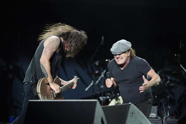 Dave Grohl and Brian Johnson onstage