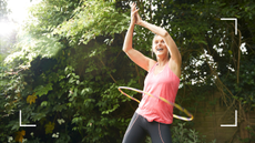 woman using a weighted hula hoop