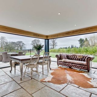 sitting area with sofa and dining table