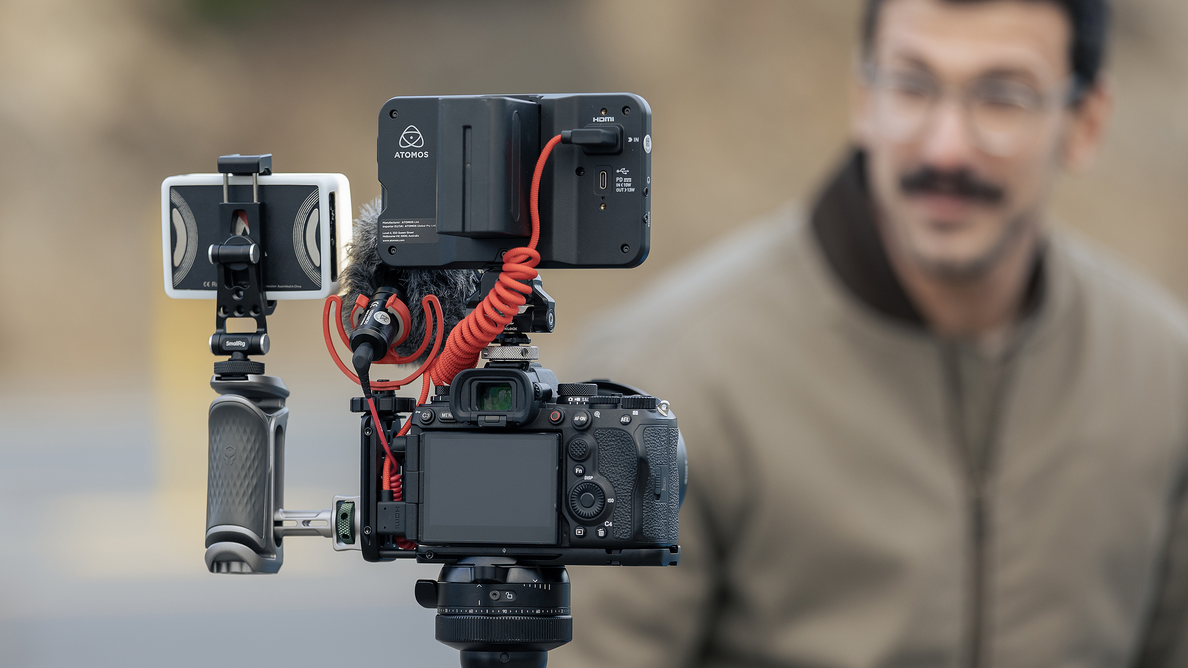 The Peak Design Field Bracket being used by a photographer