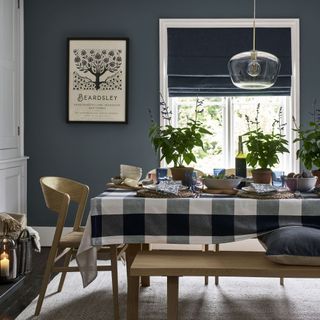 dark blue dining room with blue and white check tablecloth