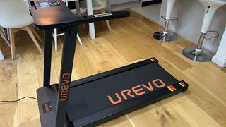 Image shows the Urevo Foldi 1 Folding Treadmill in a living room.