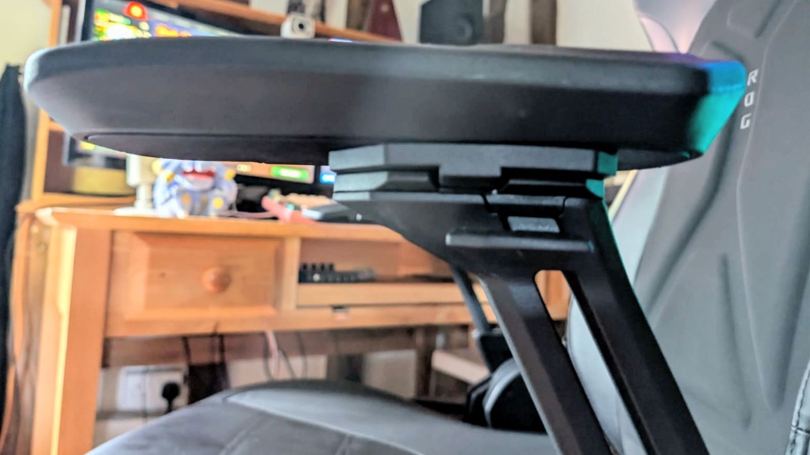 Close up on arm rest of Asus ROG Courser gaming chair