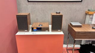 Ruark Sabre-R bookshelf speakers on display with R610 music streamer.