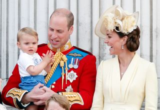 Prince William, Duke of Cambridge, Catherine, Duchess of Cambridge and Prince Louis of Cambridge stand on the balcony of Buckingham Palace during Trooping The Colour