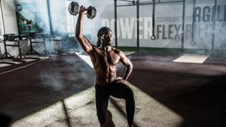 man doing a kneeling overhead press