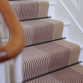 carpeted white staircase