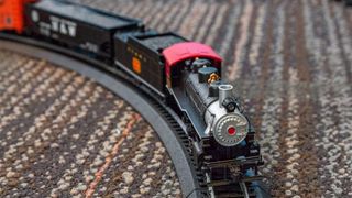 The Bachmann Chattanooga on its rails, on a carpeted surface.