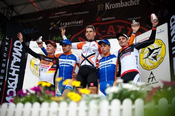The elite men's short race podium