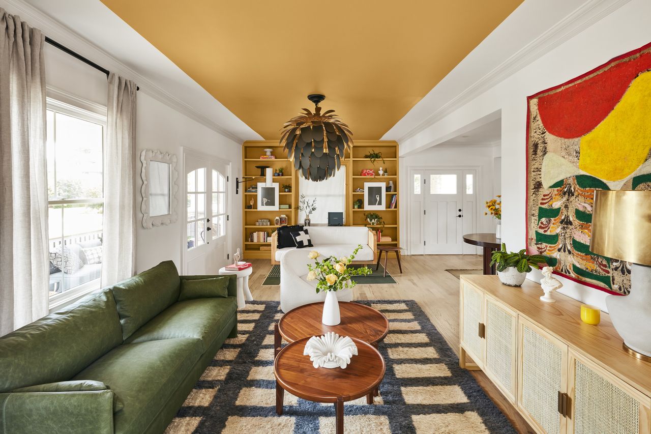 A room with a strip of yellow paint on the ceiling