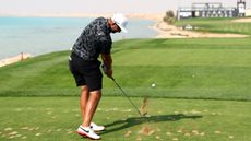 Dean Burmester takes a tee shot at LIV Golf Jeddah