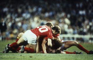 Belgium's Erwin Vandenbergh celebrates with his team-mates after scoring against Argentina at the 1982 World Cup.