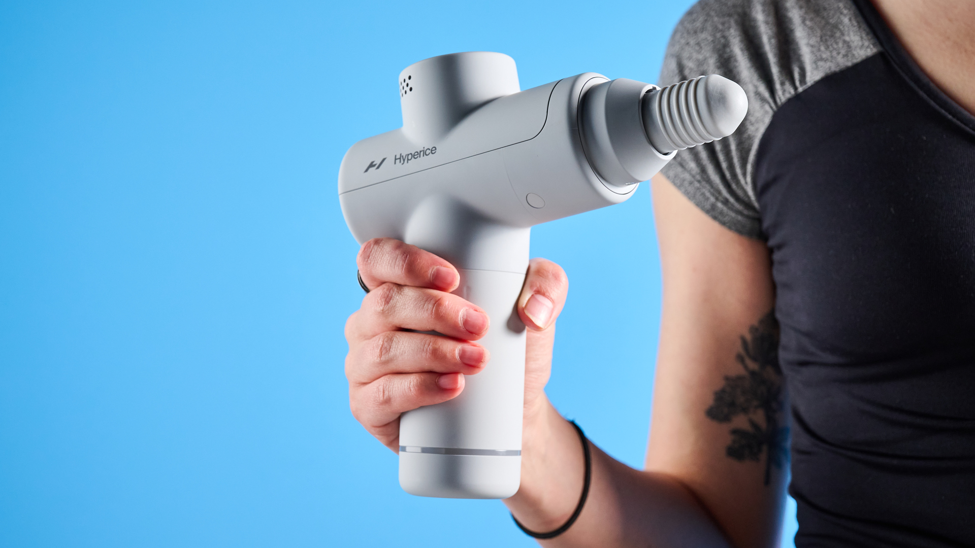 the hyperice hypervolt go 2 massage gun in white/gray with a bullet head attachment, flat head attachment, and a usb-c charging port