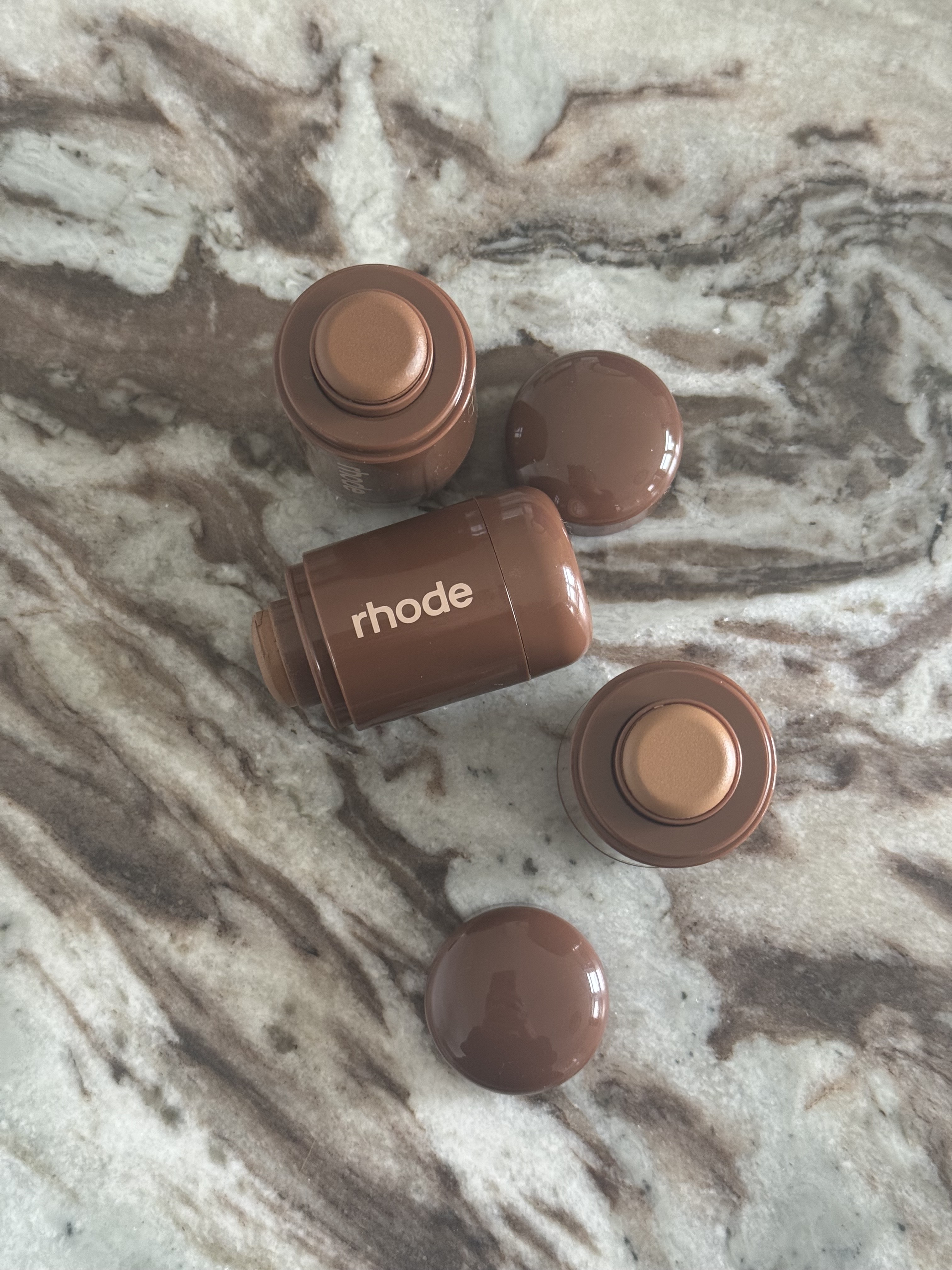 Rhode Pocket Bronzers on a marble table