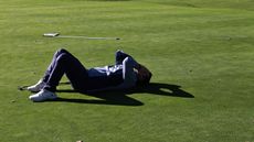 Player lying on their back in dismay